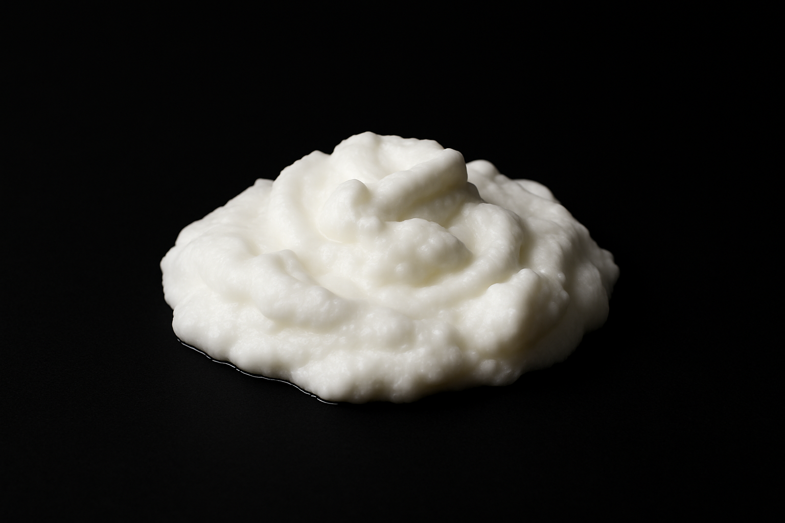 egg whites centered in the middle and on a black background