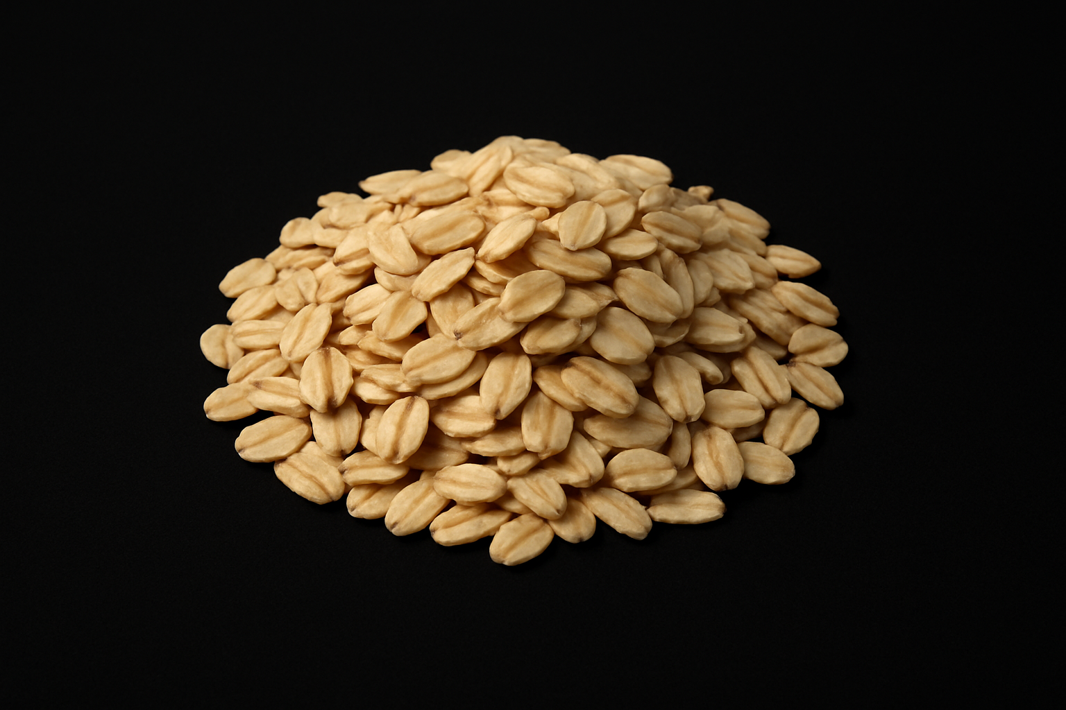 pile of whole grain oats in the middle on a black background